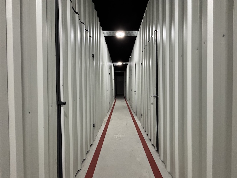 Corridor with private storage rooms